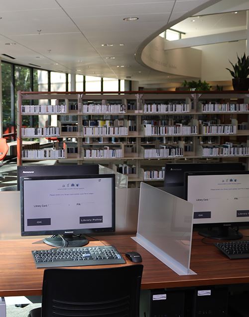 bookshelves and computer stations in a Fulton County library
