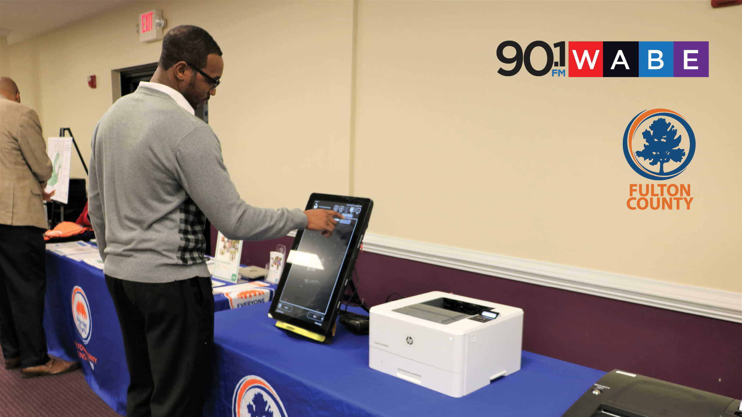 resident using new voting machine