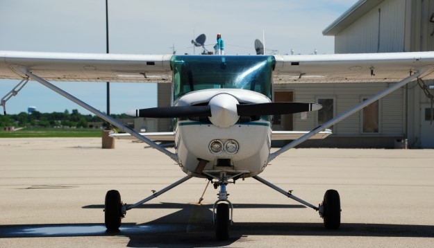 Photo of a propeller airplane on an airpor tarmac